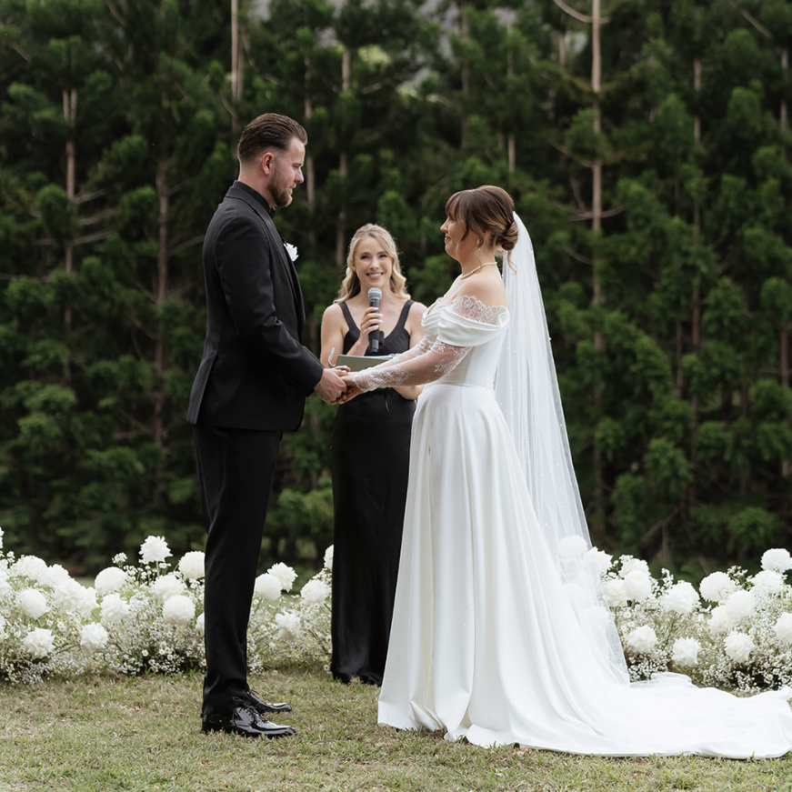 Wedding ceremony taking place outdoors
