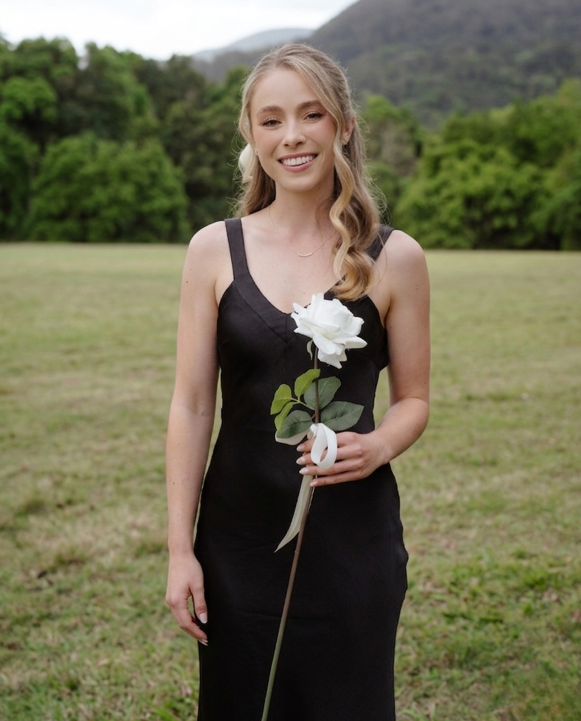 Gold Coast marriage celebrant Isabella smiling at a wedding ceremony