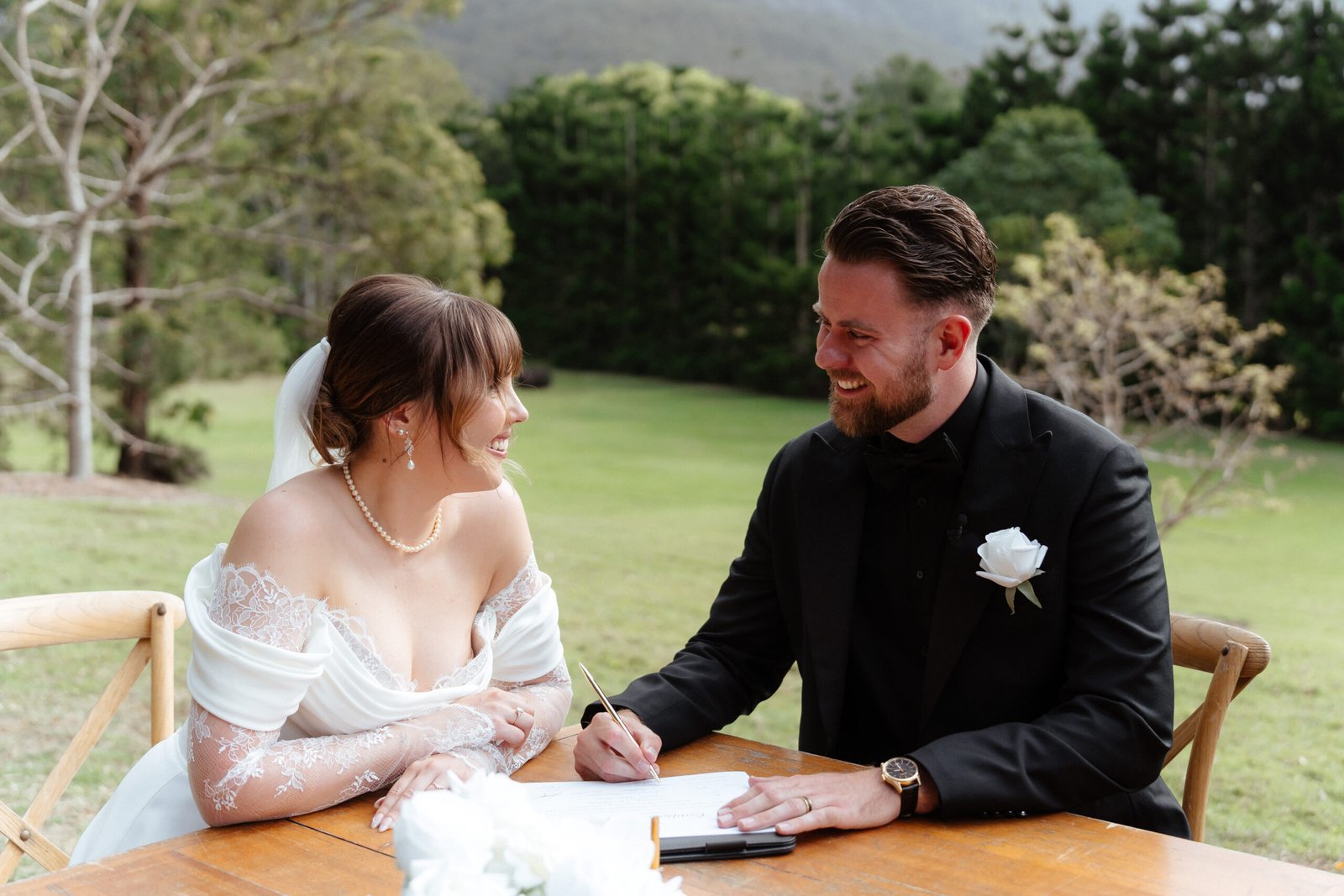 Couple completing their legal marriage signing with Gold Coast celebrant